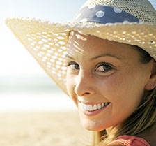 Girl in straw hat happy with Dental Implants in Waco TX